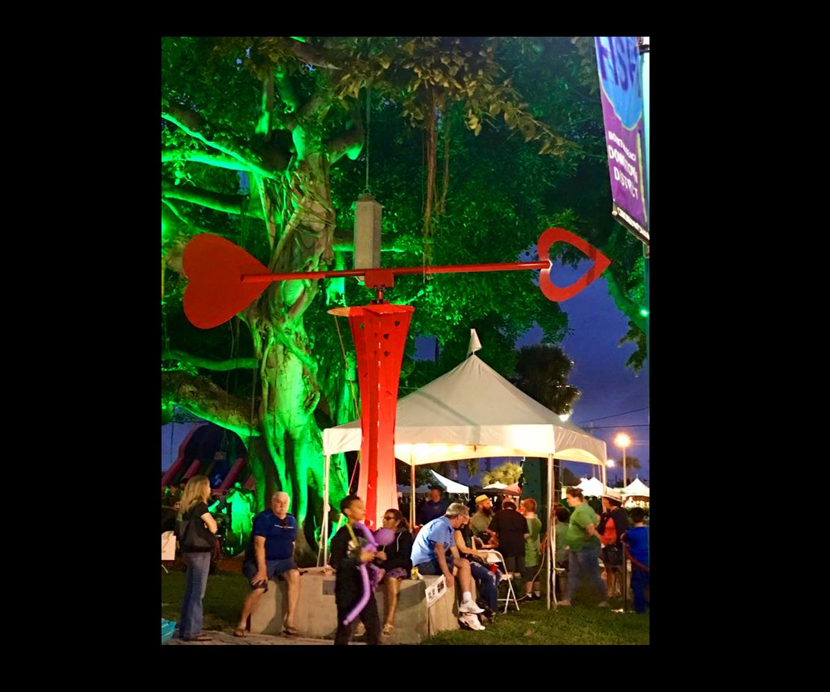 Let LOVE Guide Your Way sculpture glowing at a night event