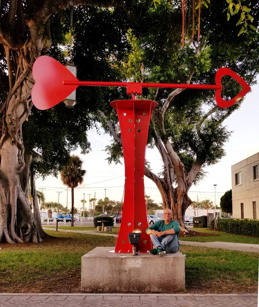 Lloyd Goradesky standing by the sculpture